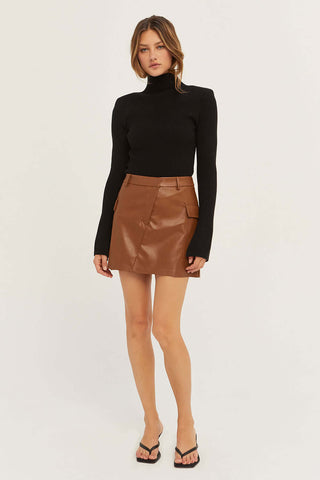 model wearing a black turtleneck sweater outfit