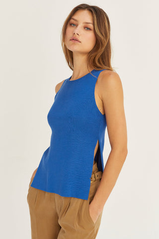 model wearing a blue knit sweater tank top