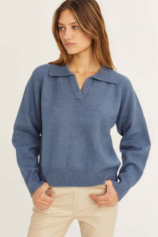 model wearing a blue raglan sleeve sweater