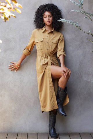 model wearing high-slit brown utility dress