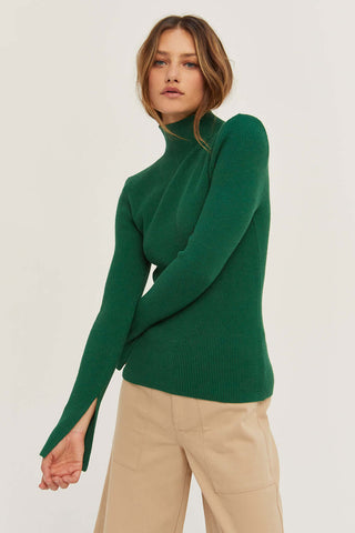 model wearing a forest green turtleneck