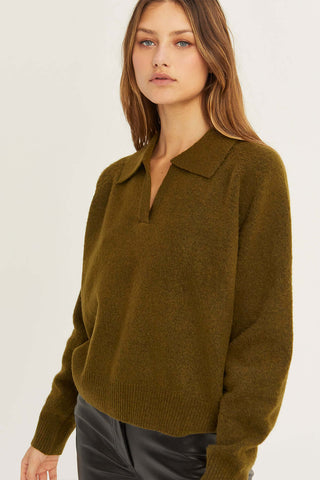 model wearing an olive collared sweater