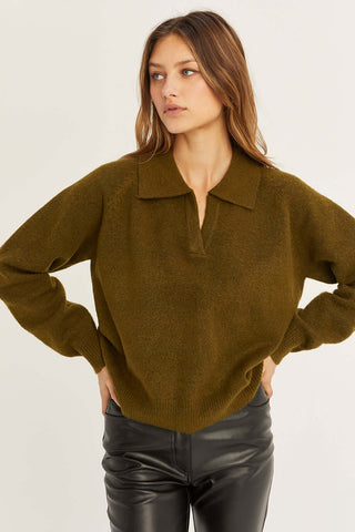 model wearing an olive polo raglan
