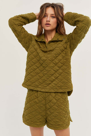model wearing an olive quilted shorts co-ord set