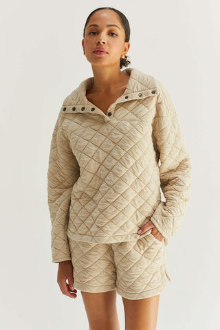 model wearing a quilted sweater with lapels