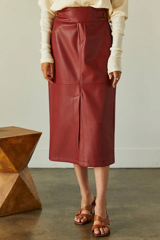 model wearing red vegan leather skirt