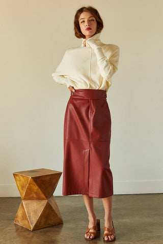 model wearing red midi skirt and white sweater